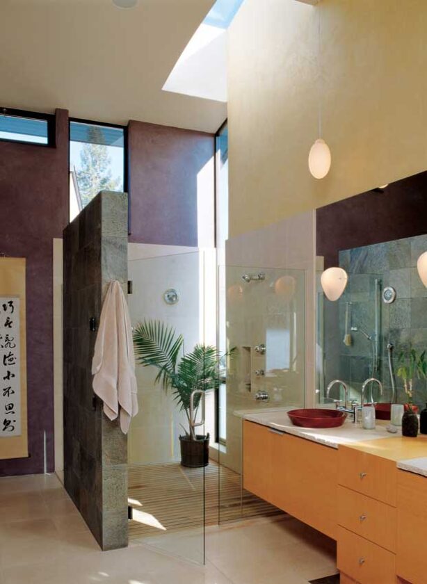 Forest Stewardship Council-certified wood shapes the master bathroom’s cabinets and sink basin. The recycled cedar shower floor—based on a Japanese bathhouse—resists moisture-driven decay and exudes a delicious woodsy aroma.